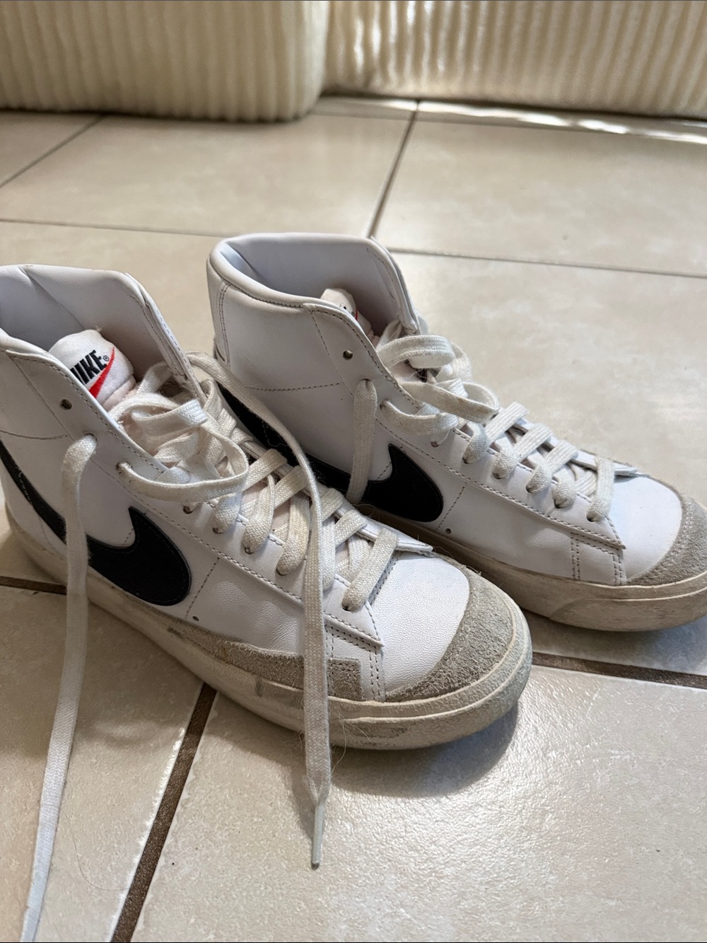 Nike White High-Top Sneakers with Black Swoosh and Gray Suede Toe